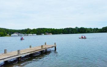 People Kayaking In A Lake