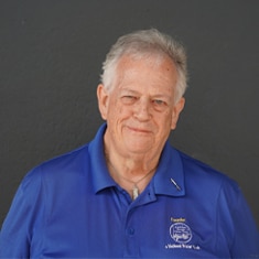 A Man In A Blue Shirt