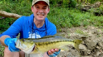 a person holding a fish