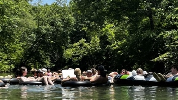 People tubing down a river