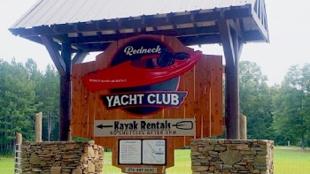 a sign in front of a house