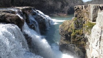Large waterfalls flowing into a canyon