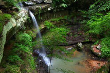Waterfall Flows Into A Deep Canyon In The Woodland Of Northern Alabama.