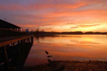 A Sunset Over A Body Of Water