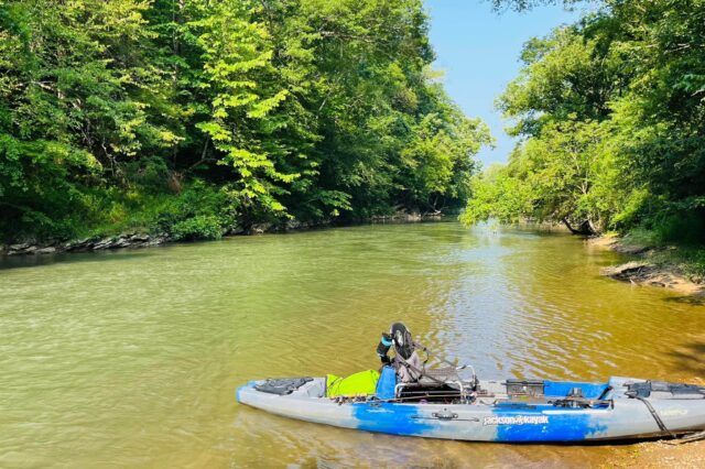 Kayak Parked On A River Bank