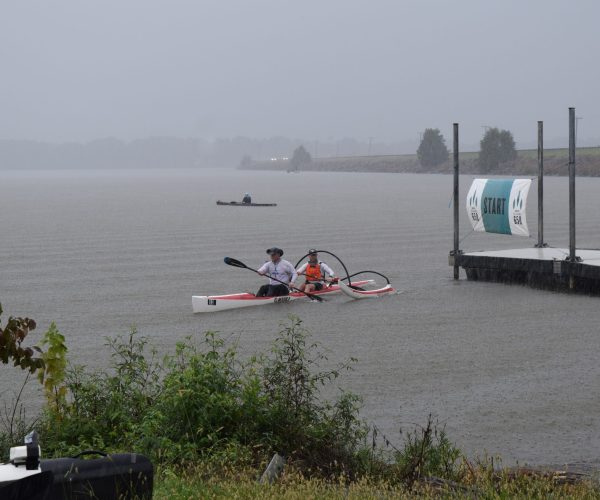 Tandem Kayakers In The Rain