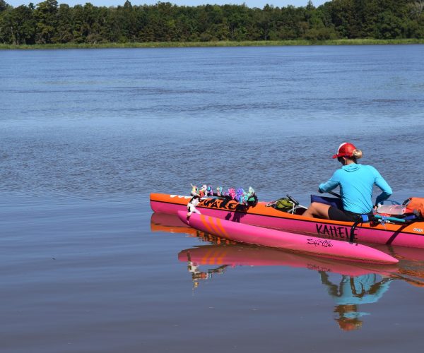 A Woman Kayaking In A River