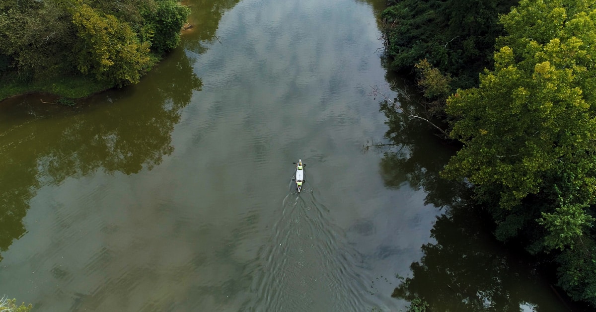Tandem Kayakers On A River