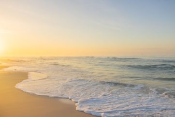 A Sunset Over A Body Of Water