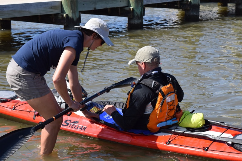 A man getting ready to kayak