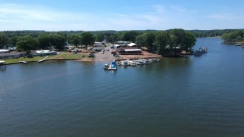 a boat is docked next to a body of water