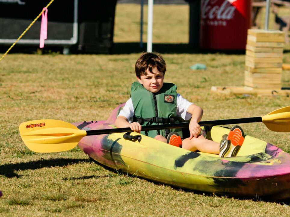 A boy sitting in a kayak