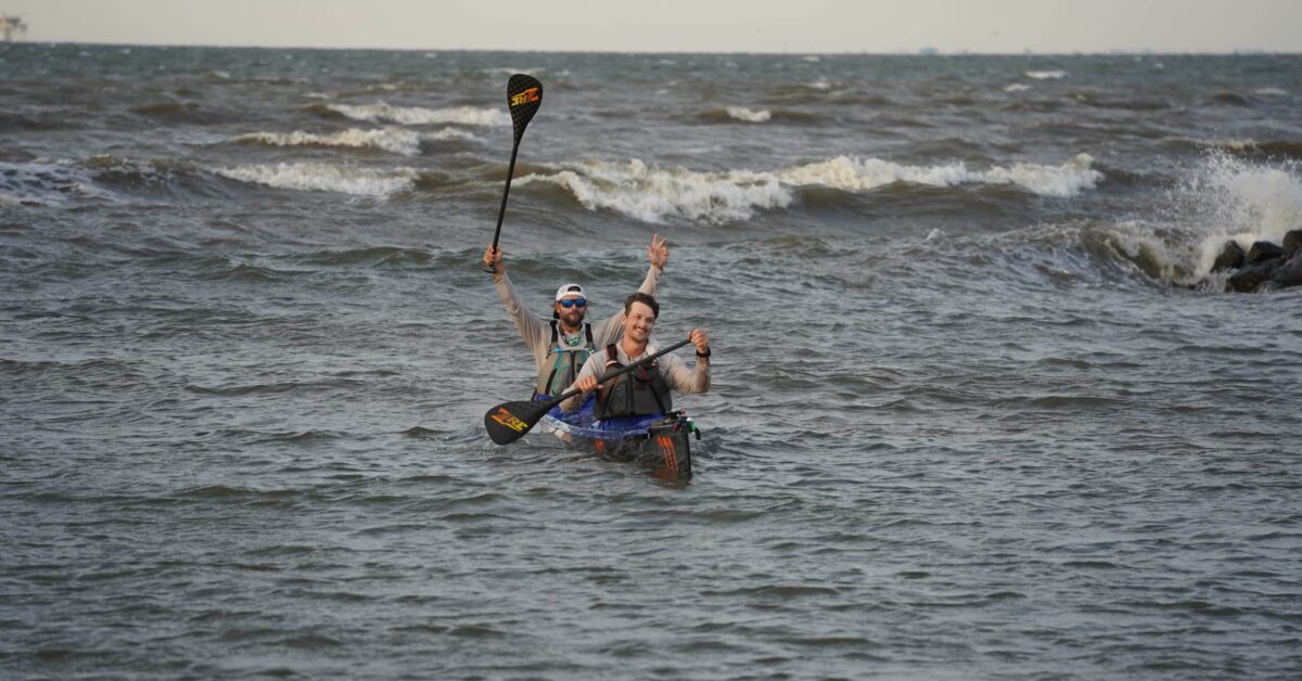 Two Men Kayaking In The Ocean
