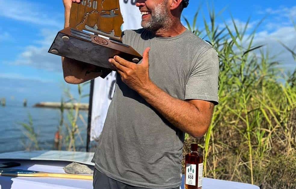 Man Holding The Alabama 650 Prize