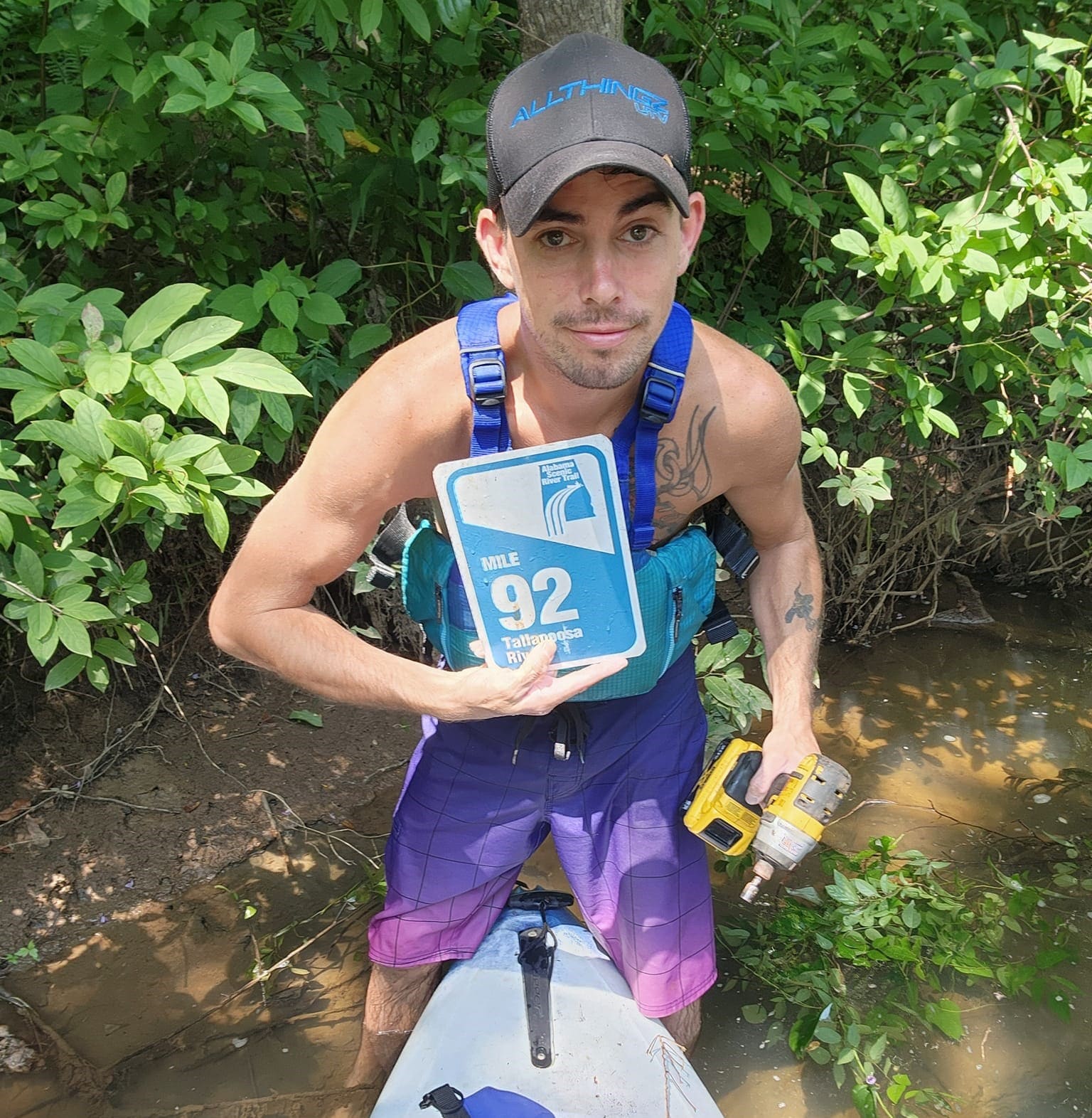 Kayaker holding Mile Marker 92