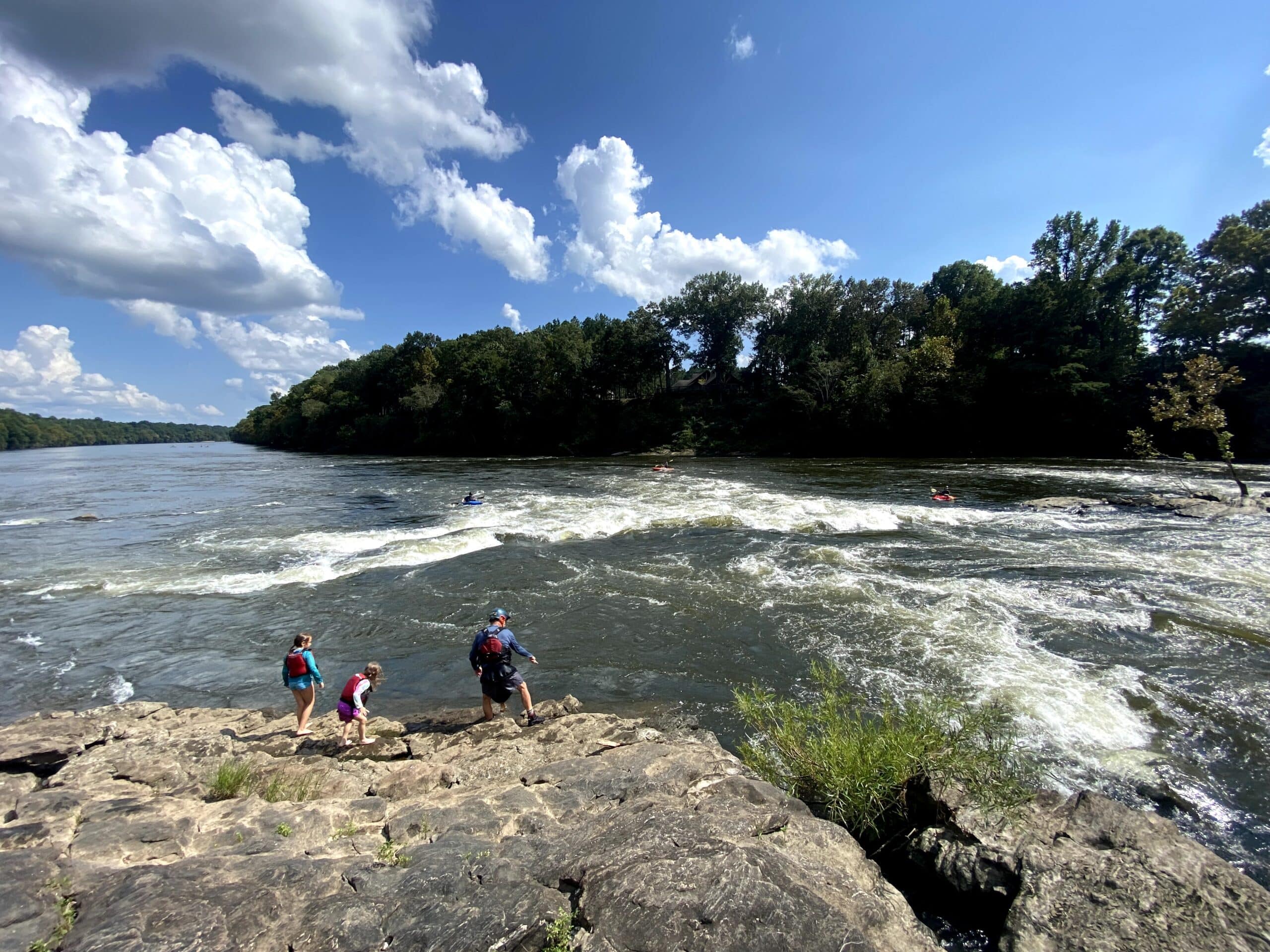 White water kayakers on a river