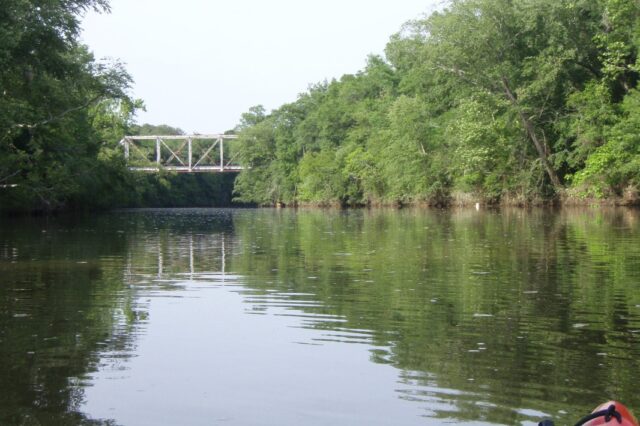 The Pea River with railroad bridge in background