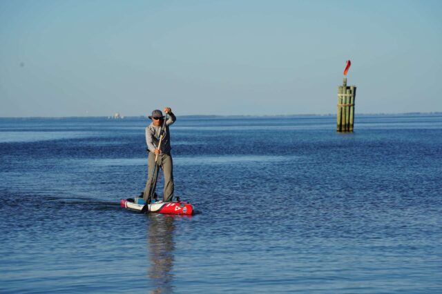 Man Paddle Boarding In The Ocean