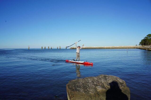 A Man Kayaking In The Ocean