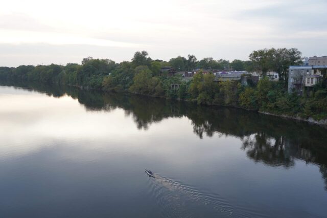 Man Kayaking Down A River