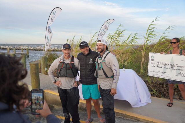 Kayaker Receiving An Award Check